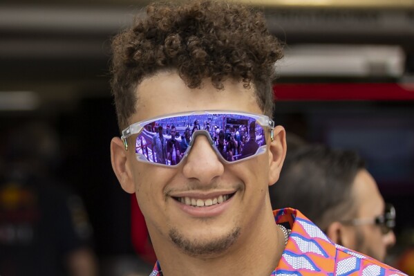 FILE - Kansas City Chiefs quarterback Patrick Mahomes arrive before the start of the Formula One Miami Grand Prix at the Miami Miami International Autodrome in Miami Gardens, Fla., Sunday, May 7, 2023. Patrick Mahomes said Wednesday, Oct. 18, 2023, that he “jumped” at the the chance to invest in a Formula One team when he was asked to join a group of celebrity backers behind the Alpine team.(Matias J. Ocner/Miami Herald via AP, File)