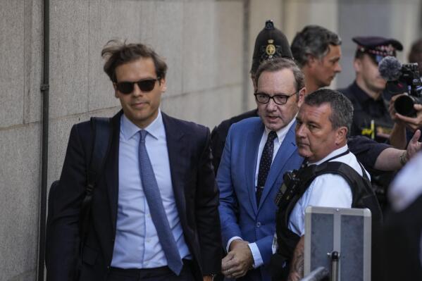 FILE - Actor Kevin Spacey, center, arrives at the Old Bailey, in London, Thursday, July 14, 2022. Actor Kevin Spacey will be charged with seven further sex offenses, all against one man, Britain’s Crown Prosecution said Wednesday, Nov. 16, 2022. (AP Photo/Frank Augstein, File)