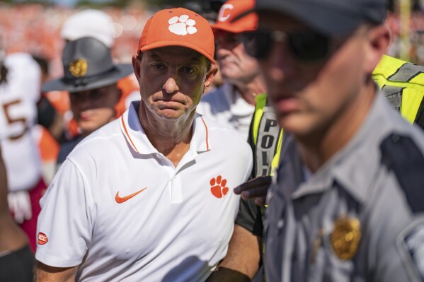 Clemson head coach Dabo Swinney walks off the field after losing to Florida State in overtime in an NCAA college football game Saturday, Sept. 23, 2023, in Clemson, S.C. (AP Photo/Jacob Kupferman)