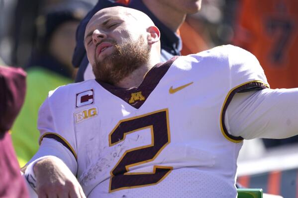 Minnesota quarterback Tanner Morgan is transported to the locker room after being injured in the second half of an NCAA college football game against Illinois, Saturday, Oct. 15, 2022, in Champaign, Ill. (AP Photo/Charles Rex Arbogast)