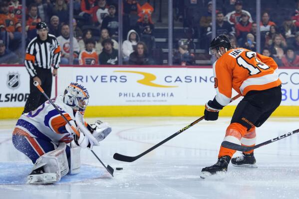 Philadelphia Flyers' Kevin Hayes, right, cannot get a shot past New York Islanders' Ilya Sorokin during the second period of an NHL hockey game, Tuesday, Nov. 29, 2022, in Philadelphia. (AP Photo/Matt Slocum)