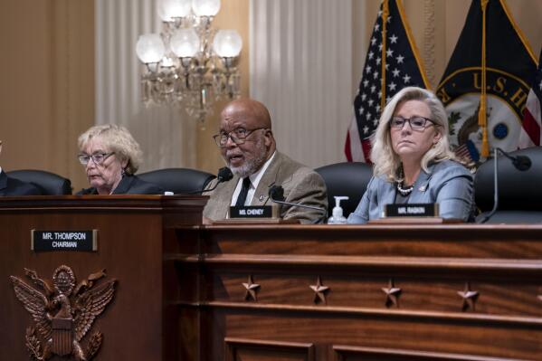 Chairman Bennie Thompson, D-Miss., center, flanked by Rep. Zoe Lofgren, D-Calif., left, and Vice Chair Liz Cheney, R-Wyo., makes a statement as the House committee investigating the Jan. 6 attack on the U.S. Capitol pushes ahead with contempt charges against former advisers to Donald Trump, Peter Navarro and Dan Scavino, in response to their refusal to comply with subpoenas, at the Capitol in Washington, Monday, March 28, 2022. Navarro, President Donald Trump's trade adviser, and Scavino, a White House communications aide under Trump, have been uncooperative in the congressional probe into the deadly 2021 insurrection. (AP Photo/J. Scott Applewhite)