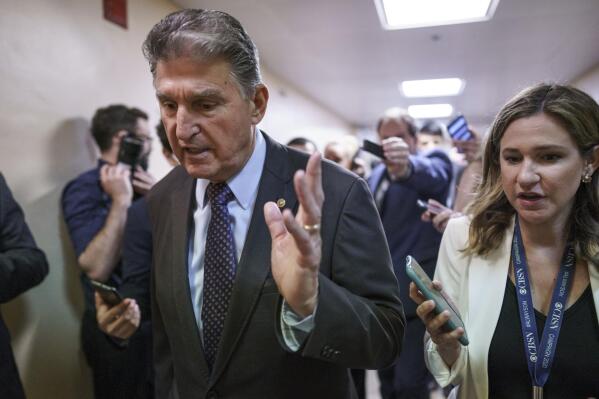 Sen. Joe Manchin, D-W.Va., a crucial 50th vote for Democrats on President Joe Biden's proposals, walks with reporters as senators go to the chamber for votes ahead of the approaching Memorial Day recess, at the Capitol in Washington, Thursday, May 27, 2021. Senate Republicans are ready to deploy the filibuster to block a commission on the Jan. 6 insurrection, shattering chances for a bipartisan probe of the deadly assault on the U.S. Capitol and reviving pressure to do away with the procedural tactic that critics say has lost its purpose. (AP Photo/J. Scott Applewhite)