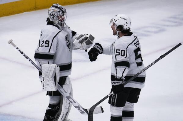 Los Angeles Kings goaltender Pheonix Copley, left, celebrates with defenseman Sean Durzi after the Kingsy defeated the Chicago Blackhawks in an NHL hockey game in Chicago, Sunday, Jan. 22, 2023. (AP Photo/Nam Y. Huh)