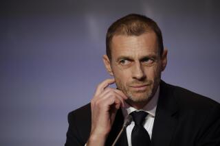 FILE - In this Thursday, Feb. 7, 2019 file photo, UEFA President Aleksander Ceferin listens to reporter's questions during a press conference at the end of the 43rd UEFA congress in Rome.  Ceferin says he has “grave concerns” about FIFA’s plans to stage World Cups every two years and is astonished by the lack of consultation by Gianni Infantino’s governing body. The comments were made in a letter to Football Supporters Europe. Ceferin says he backed the group’s “extremely valid and important” concerns about the damage doubling the frequency of World Cups would cause to domestic and regional competitions. (AP Photo/Alessandra Tarantino, File)
