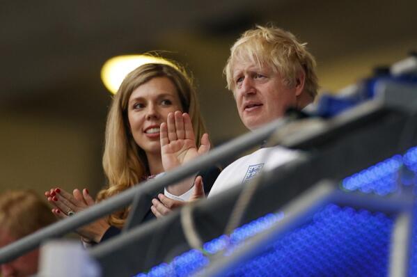 British Prime Minister Boris Johnson and his wife Carrie watch the Euro 2020 soccer championship final between England and Italy at Wembley stadium in London, Sunday, July 11, 2021. (John Sibley/Pool Photo via AP)