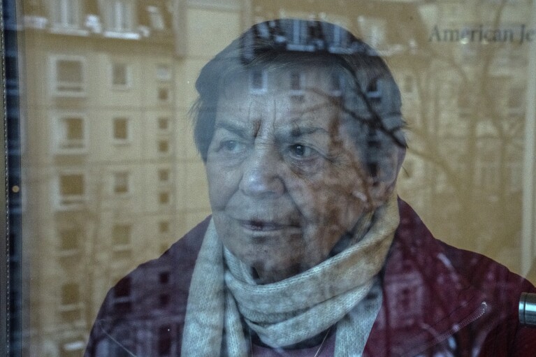 95-year-old Ruth Winkelmann, who is one of the survivors of the Holocaust, looks out of a window in Berlin, Germany, Wednesday, Jan. 17, 2024.(AP Photo/Ebrahim Noroozi)