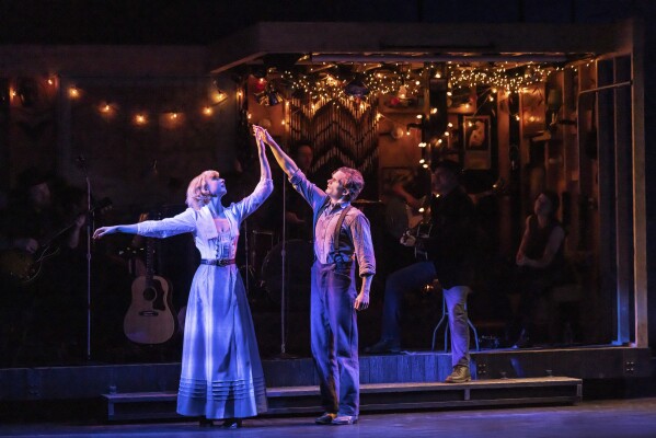 This image released by DKC/O+M shows Andrew Durand, right, and Julia Knitel during a performance of “Dead Outlaw.