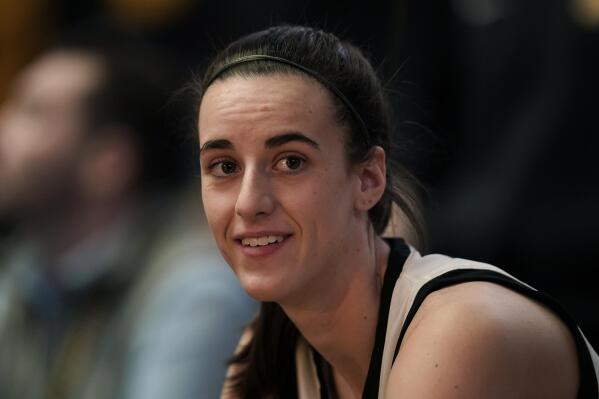 FILE - Iowa guard Caitlin Clark sits on the bench before an NCAA college basketball game against Indiana, Sunday, Feb. 26, 2023, in Iowa City, Iowa. Clark was honored Thursday, March 30, as The Associated Press women's college basketball Player of the Year. (AP Photo/Charlie Neibergall, File)