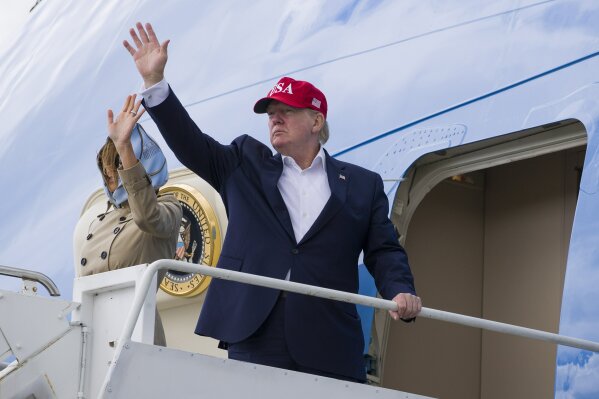 President Donald Trump, with first lady Melania Trump, waves as they depart Shannon Airport, Friday, June 7, 2019, in Shannon, Ireland. (AP Photo/Alex Brandon)