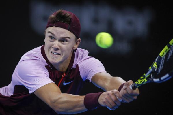 Holger Rune from Denmark returns a shot during his match against Switzerland's Marc-Andrea Huesler at the final of the 2022 Sofia Open ATP 250 tennis tournament in Sofia, Bulgaria, Sunday, Oct. 2 2022. (AP Photo/Pavel Danev)