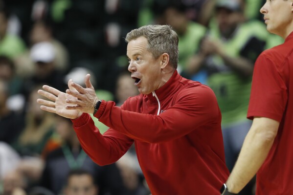 FILE - Florida Atlantic head coach Dusty May reacts during the second half of an NCAA college basketball game against South Florida, Sunday, Feb. 18, 2024, in Tampa, Fla. May is one of the hottest commodities in coaching. His name is been linked to openings at Louisville, Ohio State, Michigan and Vanderbilt. And his eight-seeded Owls start NCAA play Friday in New York against ninth-seeded Northwestern. (AP Photo/Scott Audette, File)