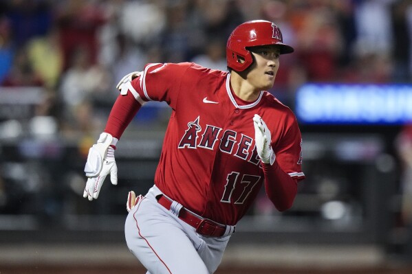 Ohtani hits 2 HRs during 1st game with Japan in over 6 years