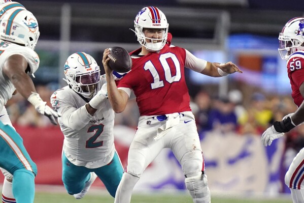 Miami Dolphins linebacker Bradley Chubb (2) brings down New England Patriots quarterback Mac Jones (10) during the fourth quarter of an NFL football game, Sunday, Sept. 17, 2023, in Foxborough, Mass. (AP Photo/Steven Senne)