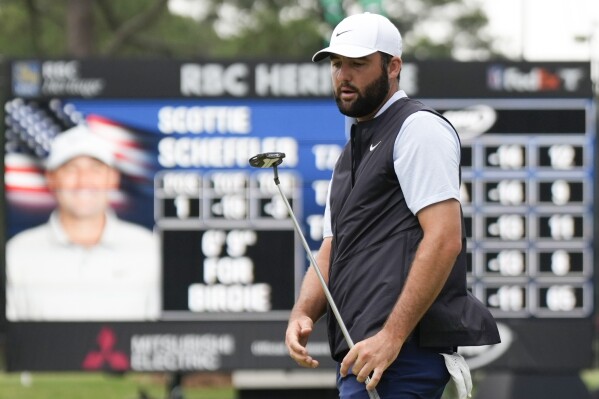 Scottie Scheffler reacts after missing a putt on the ninth hole during the final round of the RBC Heritage golf tournament, Sunday, April 21, 2024, in Hilton Head Island, S.C. (AP Photo/Chris Carlson)