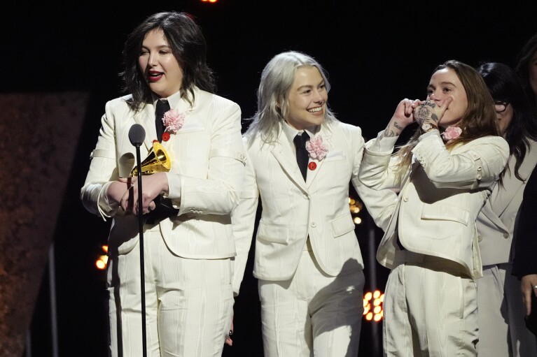 Lucy Dacus, from left, Phoebe Bridgers, Julien Baker, of boygenius accept the award for best rock performance "Not Strong Enough" during the 66th annual Grammy Awards on Sunday, Feb. 4, 2024, in Los Angeles. (APPhoto/Chris Pizzello)