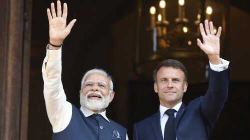 French President Emmanuel Macron and India's Prime Minister Narendra Modi wave prior to attending a meeting at the Foreign Affairs ministry in Paris, Friday, July 14, 2023. France is looking to further strengthen cooperation on an array of topics ranging from climate to military sales and the strategic Indo-Pacific region. (Julien de Rosa, Pool via AP)