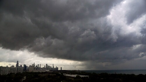 Storm clouds pass over downtown Chicago and the Bronzeville neighborhood of the city heading East out over Lake Michigan as the National Weather Service continued to issue multiple tornado warnings in the greater metropolitan area Wednesday, July 12, 2023. (AP Photo/Charles Rex Arbogast)