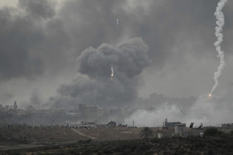 Smoke rises following an Israeli airstrike in the Gaza Strip, as seen from southern Israel, Wednesday, Nov. 22, 2023. (AP Photo/Leo Correa)