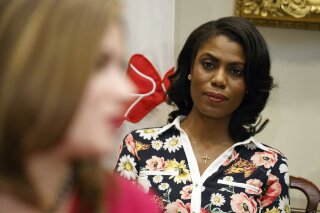 
              FILE - In this Feb. 14, 2017, file photo, Omarosa Manigault-Newman, then an aide to President Donald Trump, watches during a meeting with parents and teachers in the Roosevelt Room of the White House in Washington. The White House is slamming a new book by ex-staffer Omarosa Manigault-Newman, calling her “a disgruntled former White House employee.” (AP Photo/Evan Vucci, File)
            