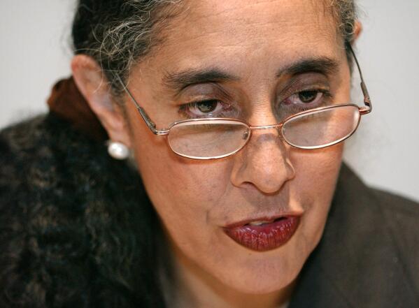 FILE - Harvard law professor Lani Guinier speaks to reporters before her remarks at the Martin Luther King Jr. Memorial Breakfast in Boston, on Jan. 17, 2005. Guinier, a pioneering civil rights lawyer and scholar whose nomination by President Bill Clinton to head the Justice Department's civil rights division was pulled after conservatives labeled her “quota queen,” has died at 71. (AP Photo/Josh Reynolds, File)