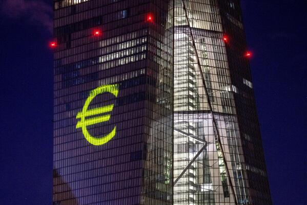 FILE - A light installation is projected onto the building of the European Central Bank during a rehearsal in Frankfurt, Germany, Dec. 30, 2021. Inflation hit a new record in the 19 countries that use the euro currency, fueled by out-of-control prices for natural gas and electricity due to the war in Ukraine, the European Union statistics agency Eurostat reported Monday, Oct. 31, 2022. (AP Photo/Michael Probst, File)