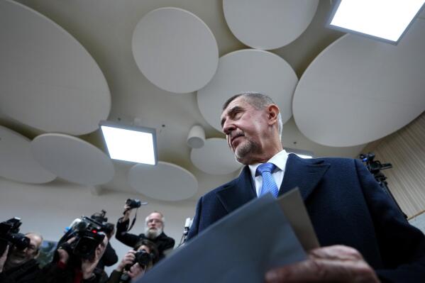 Presidential candidate Andrej Babis arrives to cast his vote at a polling station during the first round of presidential election in Pruhonice, Czech Republic, Friday, Jan. 13, 2023. (AP Photo/Petr David Josek)