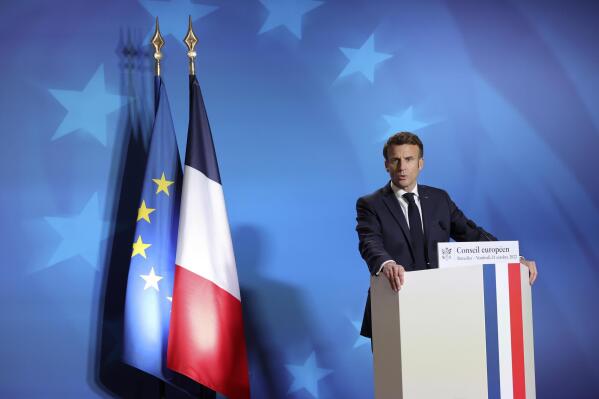 French President Emmanuel Macron speaks during a media conference at an EU summit in Brussels, Friday, Oct. 21, 2022. European Union leaders gathered Friday to take stock of their support for Ukraine after President Volodymyr Zelenskyy warned that Russia is trying to spark a refugee exodus by destroying his war-ravaged country's energy infrastructure. (AP Photo/Olivier Matthys)