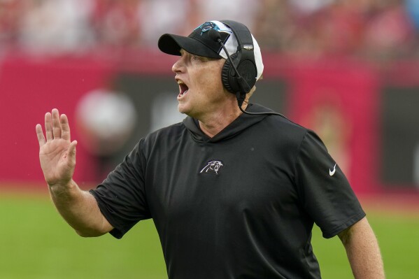 Carolina Panthers interim head coach Chris Tabor yells during the first half of an NFL football game against the Tampa Bay Buccaneers Sunday, Dec. 3, 2023, in Tampa, Fla. (AP Photo/Chris O'Meara)