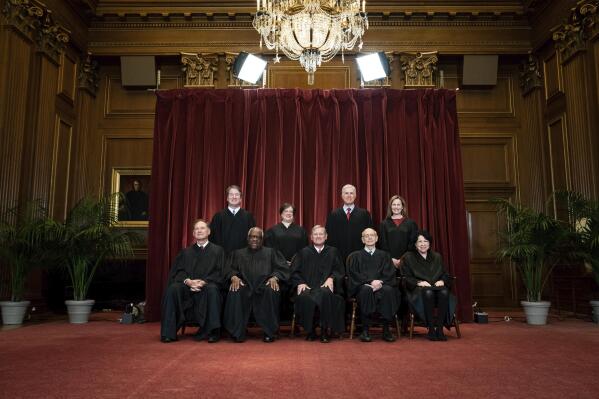 FILE - Members of the Supreme Court pose for a group photo at the Supreme Court in Washington, April 23, 2021. Seated from left are Associate Justice Samuel Alito, Associate Justice Clarence Thomas, Chief Justice John Roberts, Associate Justice Stephen Breyer and Associate Justice Sonia Sotomayor, Standing from left are Associate Justice Brett Kavanaugh, Associate Justice Elena Kagan, Associate Justice Neil Gorsuch and Associate Justice Amy Coney Barrett. Judge Ketanji Brown Jackson will join a Supreme Court that is both more diverse than ever and more conservative than it's been since the 1930s. She's likely to be on the losing end of a bunch of important cases, including examinations of the role of race in college admissions and voting rights. The high court, with its 6-3 conservative majority, will take up those cases next term. (Erin Schaff/The New York Times via AP, Pool, File)