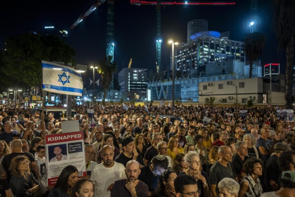 FILE - People demonstrate alongside relatives of people kidnapped during the Oct. 7 Hamas cross-border attack in Israel, during a protest calling for the return of the hostages, in Tel Aviv, Israel, Saturday, Nov. 4, 2023. At a time when world sentiment has begun to sour on Israel's devastating airstrikes in Gaza, the vast majority of Israelis, across the political spectrum, are convinced of the justice of the war. (AP Photo/Bernat Armangue, File)