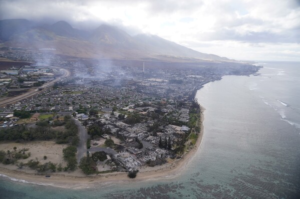 FILE - A wasteland of burned out homes and obliterated communities is left on Aug. 10, 2023, in Lahaina, Hawaii, following a stubborn blaze. Experts say the fires are likely to transform the landscape in unwanted ways, hasten erosion, send sediment into waterways and degrade coral that’s critically important to the islands, marine life and people who live near it. (AP Photo/Rick Bowmer, File)