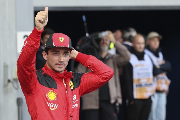 Ferrari driver Charles Leclerc of Monaco gives the thumbs up after placing second in the qualification session ahead of the Formula One Grand Prix at the Spa-Francorchamps racetrack in Spa, Belgium, Friday, July 28, 2023. The Belgian Formula One Grand Prix will take place on Sunday. (AP Photo/Geert Vanden Wijngaert)