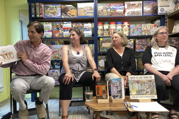 Vermont Lt. Gov. David Zuckerman reads the book "And Tango Makes Three," at Bridgeside Books in Waterbury, Vt., Aug. 13, 2023, as part of his banned book reading tour. (AP Photo/Lisa Rathke)
