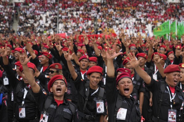 Supporters of Indonesian Democratic Party of Struggle (PDIP) shout slogans during a campaign rally at Gelora Bung Karno Main Stadium in Jakarta, Indonesia, Saturday, Feb. 3, 2024. Tens of thousands of Indonesians flocked to presidential campaign rallies of the governing party's presidential hopeful on Saturday amid growing public concerns of deteriorating democracy in Southeast Asia's largest economy. (AP Photo/Achmad Ibrahim)