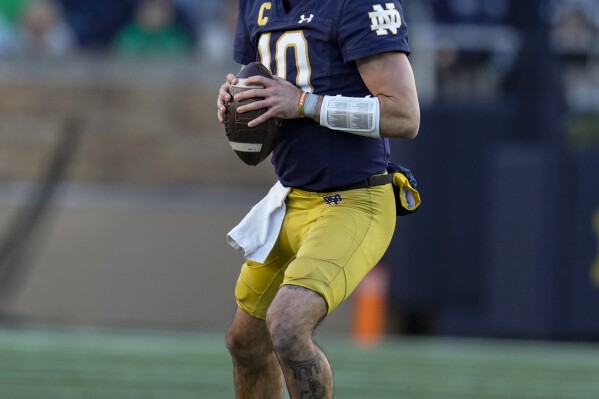 Notre Dame quarterback Sam Hartman (10) throws against Wake Forest during the first half of an NCAA college football game in South Bend, Ind., Saturday, Nov. 18, 2023. (AP Photo/Michael Conroy)