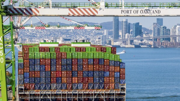 Shipping containers line the Ever Most cargo vessel docked at the Port of Oakland on Thursday, April 3, 2025, in Oakland, Calif. (AP Photo/Noah Berger)