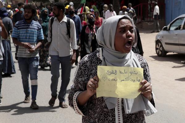 Sudanese demonstrators take to the streets to protest last year's military coup which deepened the country's political and economic turmoil, in Khartoum, Sudan, Thursday, March. 30, 2022. (AP Photo/Marwan Ali)