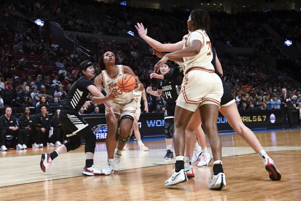 Texas forward Aaliyah Moore (23) looks to shoot against Gonzaga during the first half of a Sweet 16 college basketball game in the women's NCAA Tournament, Friday, March 29, 2024, in Portland, Ore. (AP Photo/Steve Dykes)