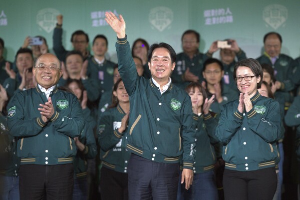 FILE - Taiwanese Vice President Lai Ching-te, also known as William Lai, center, celebrates his victory with running mate Bi-khim Hsiao, right, and supporters in Taipei, Taiwan on Jan. 13, 2024. Taiwan's incoming president is promising more of the same. The question is what that will bring, not only for Taiwan but also for its relations with China, the United States and others with an interest in the island of 23 million people that supplies many of the advanced semiconductors that keep the world running. (AP Photo/Chiang Ying-ying, File)