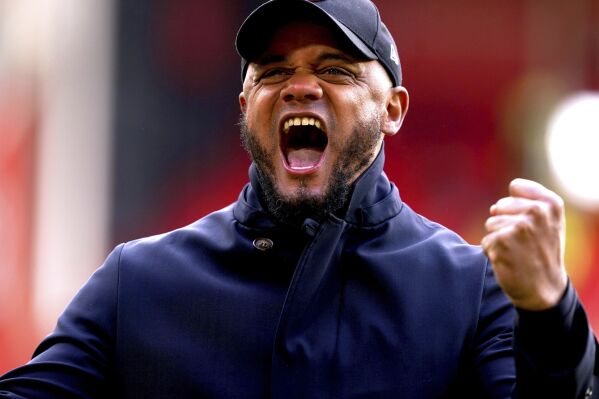 Burnley manager Vincent Kompany celebrates at the end of the English Premier League soccer match between Burnley FC and Sheffield United at Bramall Lane, Sheffield, England, Saturday April 20, 2024. (Martin Rickett/PA via AP)