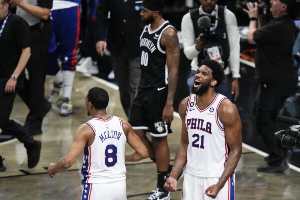 Philadelphia 76ers' Joel Embiid (21) celebrates with De'Anthony Melton (8) after the team's win over the Brooklyn Nets in Game 3 of an NBA basketball first-round playoff series Thursday, April 20, 2023, in New York. The 76ers won 102-97. (AP Photo/Frank Franklin II)