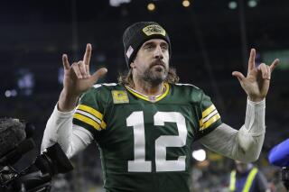Green Bay Packers' Aaron Rodgers walks off the field after an NFL football game against the Seattle Seahawks Sunday, Nov. 14, 2021, in Green Bay, Wis. The Packers won 17-0. (AP Photo/Aaron Gash)