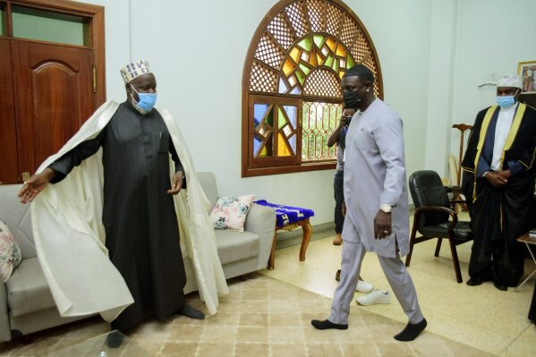 Senegalese - American performer Akon, right, is welcomed by the Mufti of Uganda, Shiekh Shaban  Mubajje, at the Gaddafi National mosque, in Kampala, Uganda, Friday, April 2, 2021. Akon is visiting ...