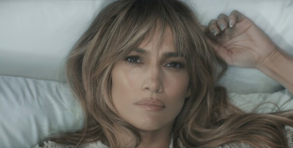 This image released by Prime shows Jennifer Lopez in a scene from "This Is Me...Now: A Love Story." (Prime via AP)