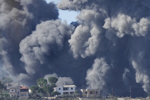 Black smoke rises from an Israeli airstrike on the outskirts of Aita al-Shaab, a Lebanese border village with Israel in south Lebanon, Saturday, Nov. 4, 2023. The Lebanon-Israel border has been the site of regular clashes between Israeli forces on one side and Hezbollah and Palestinian armed groups on the other since the beginning of the Israel-Hamas war. (AP Photo/Hussein Malla)