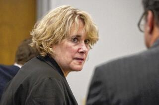FILE - In this Sept. 6, 2017 file photo, Christina Fay of Wolfeboro attends District Court at the Carroll County Superior Courthouse in Ossipee, N.H. An attorney for Fay, convicted of 10 counts of animal cruelty after dozens of her Great Danes were found sick and living in filthy conditions in her home, is scheduled to argue her appeal before the state Supreme Court on Wednesday, Feb. 12, 2020. (Elizabeth Frantz/The Concord Monitor via AP, File)