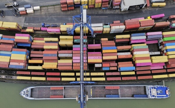 Containers are stored at a container terminal in Frankfurt, Germany, Friday, April 25, 2025. (AP Photo/Michael Probst)