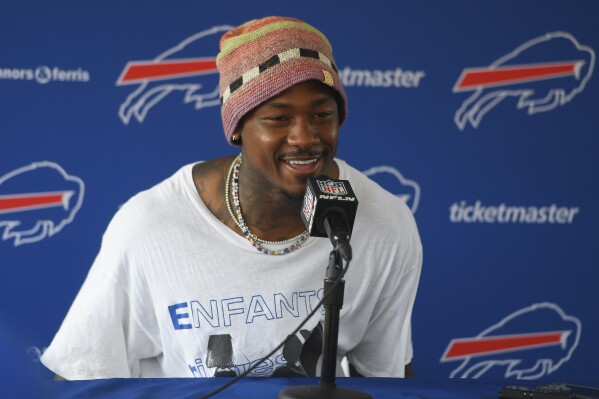 Buffalo Bills wide receiver Stefon Diggs speaks at a news conference after practice at the NFL football team's training camp in Pittsford, N.Y., Wednesday, July 26, 2023. (AP Photo/Adrian Kraus)