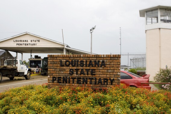 FILE - Vehicles enter at the main security gate at the Louisiana State Penitentiary — the Angola Prison, the largest high-security prison in the country in Angola, La., Aug. 5, 2008. A federal judge ruled on Friday, Sept. 8, 2023 that incarcerated youths be removed from a temporary lockup, at a former death row building in Louisiana’s adult maximum-security prison.(AP Photo/Judi Bottoni, File)